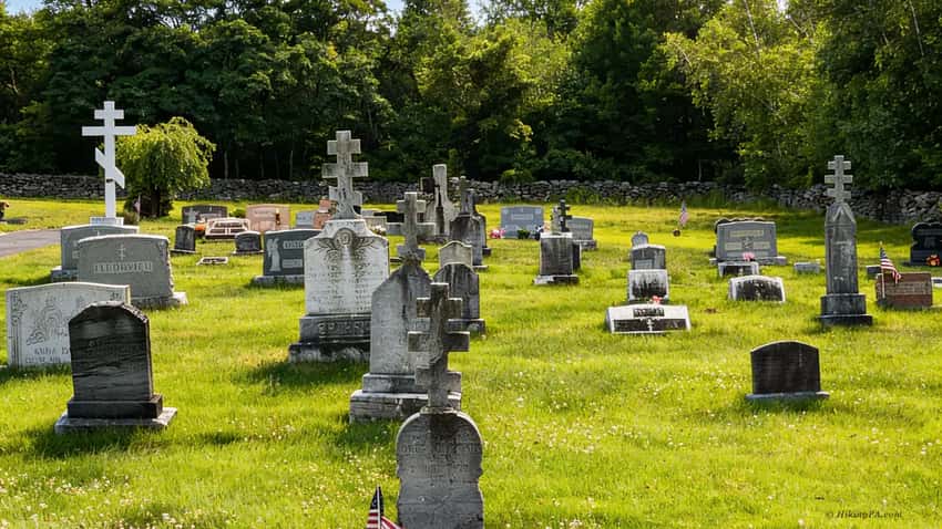 Headstones in the Odd Fellows Cemetery with the empty town grid in the background