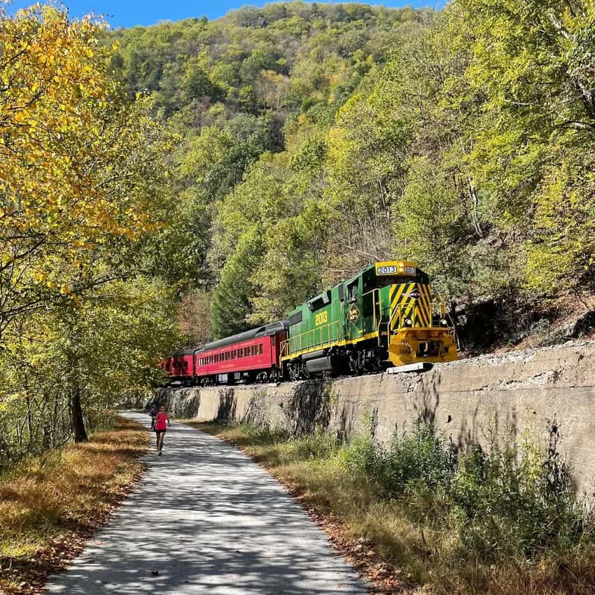 A wide perspective of the crushed-stone D&L Trail corridor in Lehigh Gorge